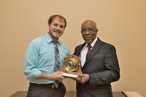 Richard Benjamin of ExxonMobil presents the award to McKenna Stanford.