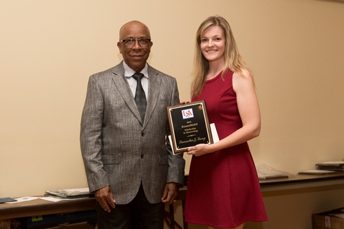 Richard Benjamin of ExxonMobil presents the 2016 ExxonMobil Scholarship Award to Samantha Lucey.