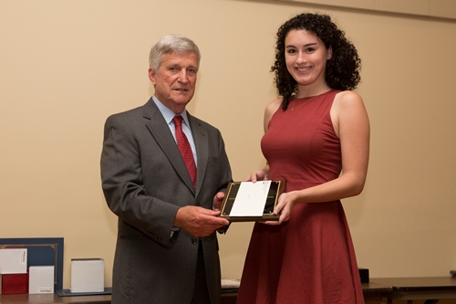 Dr. Bill Williams presents an Endowment Scholarship to Alysa Carsley.