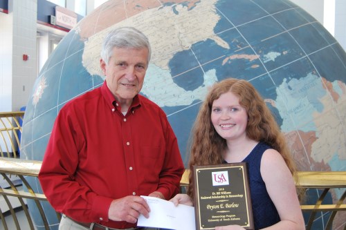 Dr. Bill Williams presents an Endowment Scholarship to Peyton Barlow.