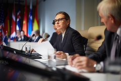 Woman speaking at politcial meeting.