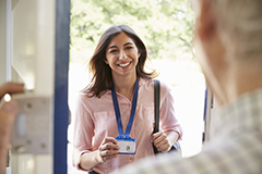 Woman showing her badge walking into a building,