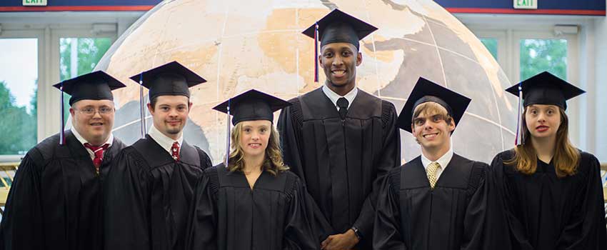 Passage USA Graduates standing in front of the Waterman Globe