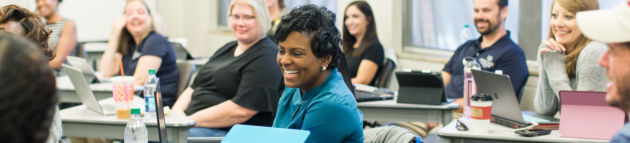 PhD female student smiling in class