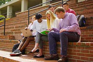 Students studying outside on campus.