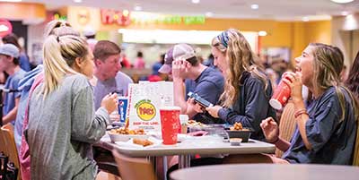 Student getting food in Dining Services.