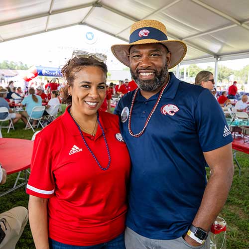 Married alumni at the homecoming alumni tent.