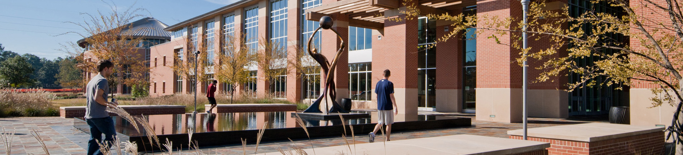 Student Recreation Center building with students walking in.