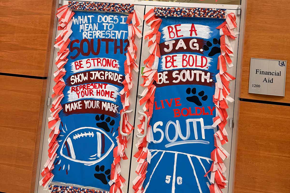 Financial Aid doors decorated for homecoming with what represents South.
